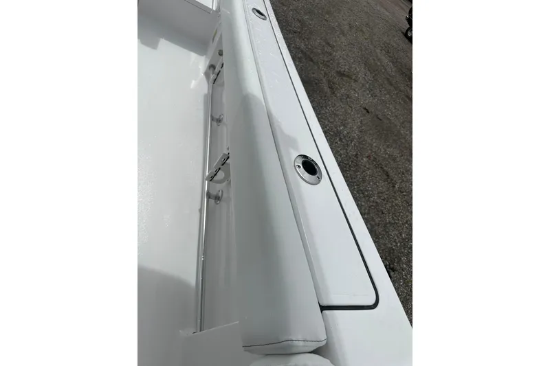 Slide: The Image of 2026 Sportsman Open 232 Center Console boat interior detail, featuring sleek white design. - 35