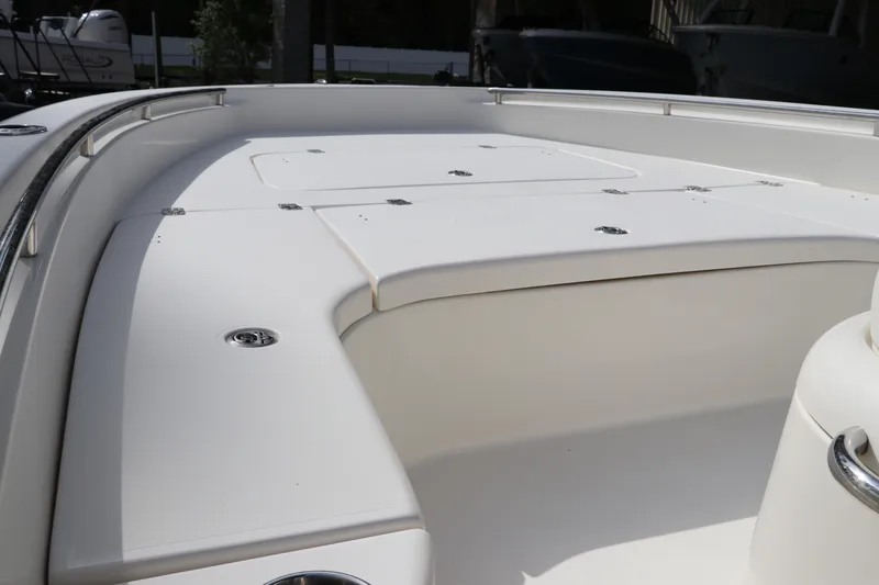 Slide: The Image of 2018 ShearWater 25 LTZ boat deck with sleek white finish and stainless steel fittings. - 43
