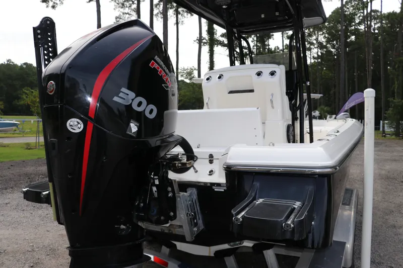 Slide: The Image of 2018 ShearWater 25 LTZ boat with powerful Mercury 300 engine, parked outdoors. - 7