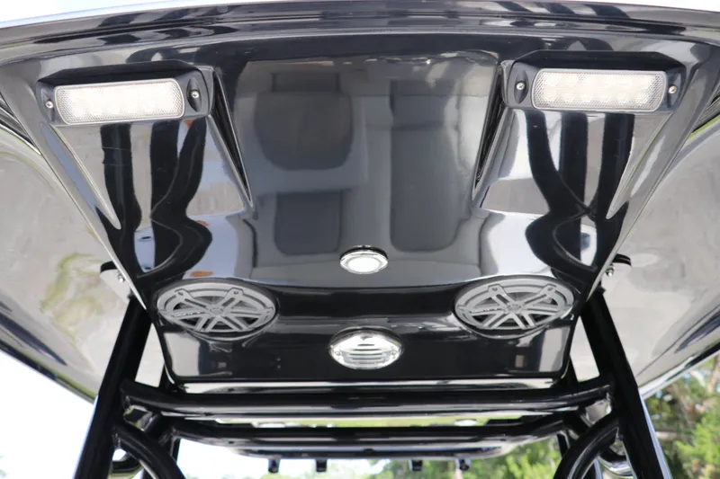 Slide: The Image of 2018 ShearWater 25 LTZ boat T-top with integrated speakers and lights. - 36