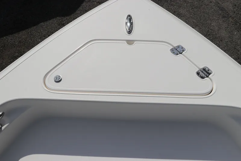 Slide: The Image of Bow storage compartment on a 2018 ShearWater 25 LTZ boat, featuring stainless steel hinges. - 41