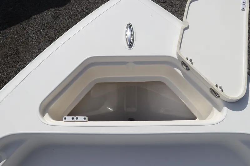 Slide: The Image of Open storage compartment on a 2018 ShearWater 25 LTZ boat deck. - 42