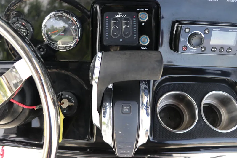 Slide: The Image of Dashboard of a 2018 ShearWater 25 LTZ boat with controls and gauges. - 25