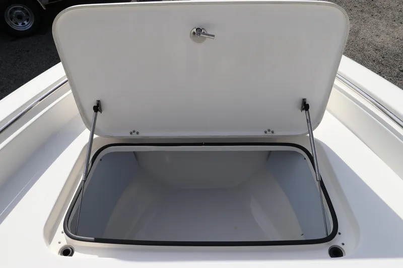 Slide: The Image of Open storage compartment on a 2018 ShearWater 25 LTZ boat. - 40