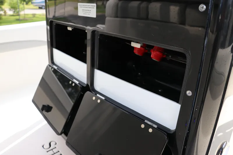 Slide: The Image of 2018 ShearWater 25 LTZ boat storage compartments with open lids. - 29