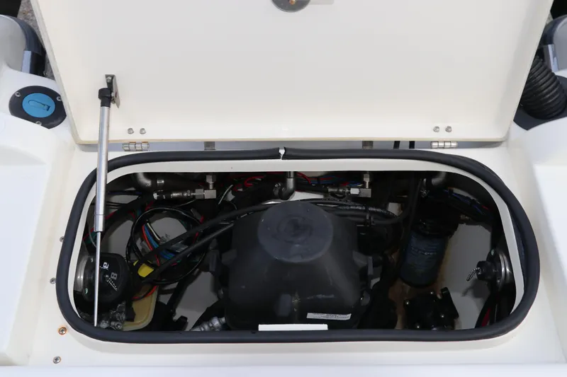 Slide: The Image of Engine compartment of a 2018 ShearWater 25 LTZ boat, showcasing internal components. - 10