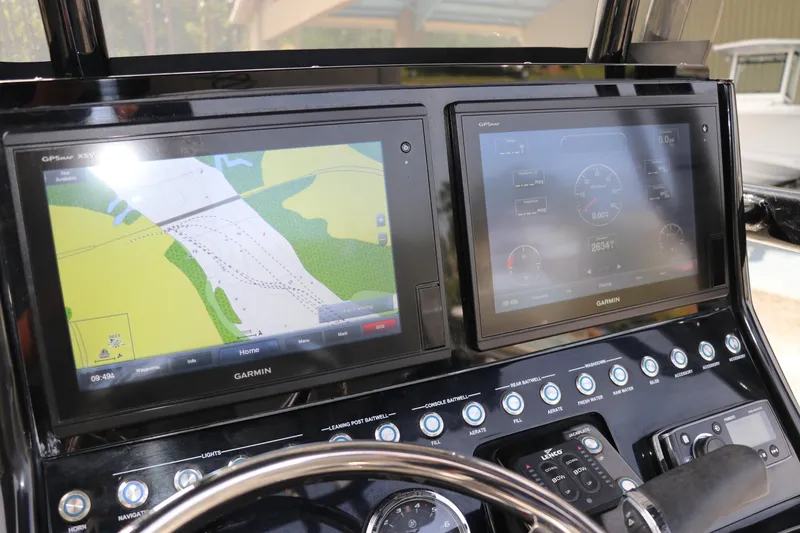 Slide: The Image of Dashboard of 2018 ShearWater 25 LTZ boat with dual Garmin displays. - 27