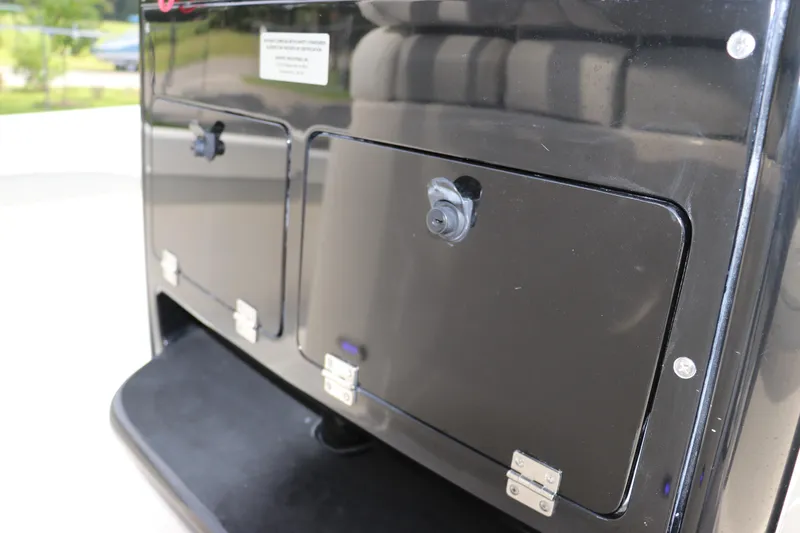 Slide: The Image of Black storage compartments on a 2018 ShearWater 25 LTZ boat. - 28