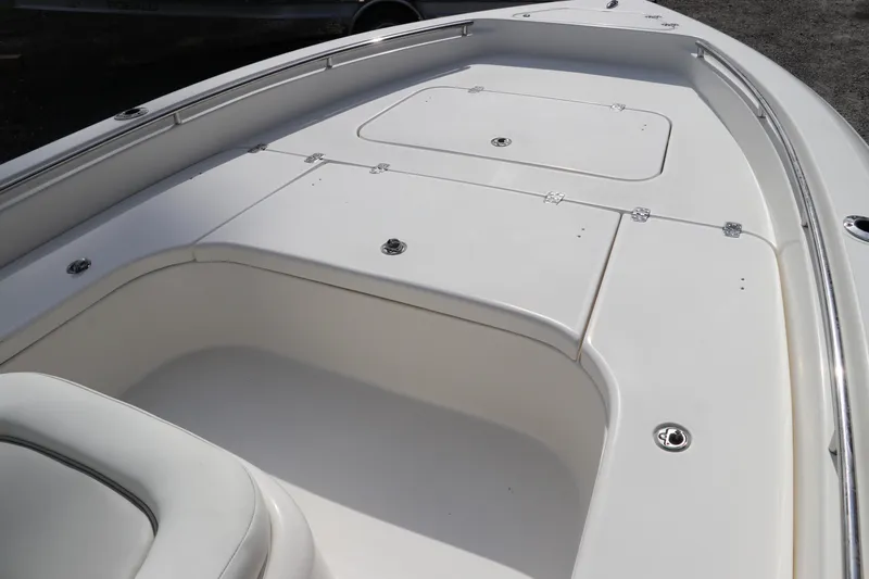 Slide: The Image of 2018 ShearWater 25 LTZ boat deck with storage compartments and sleek design. - 37
