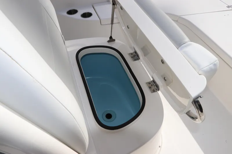 Slide: The Image of 2018 ShearWater 25 LTZ boat with open storage compartment and seating. - 35