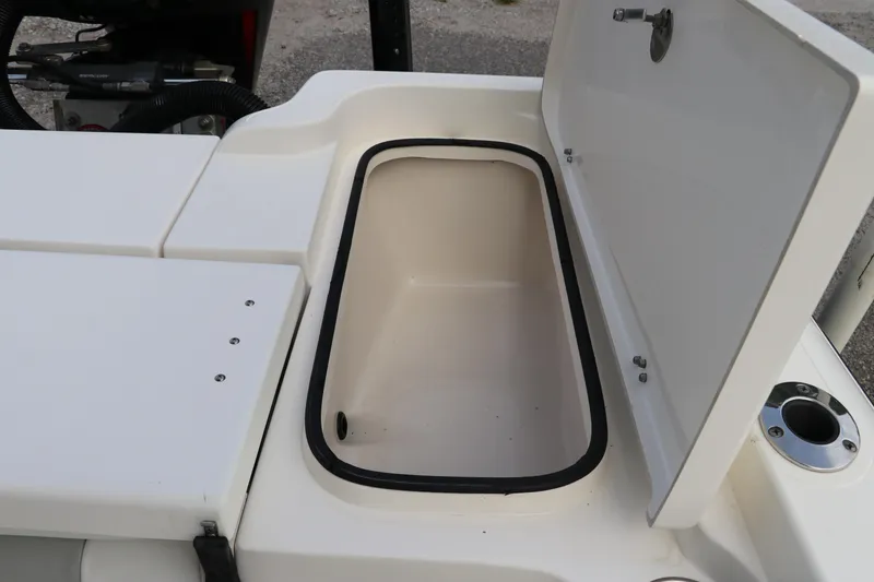 Slide: The Image of Open storage compartment on a 2018 ShearWater 25 LTZ boat. - 11