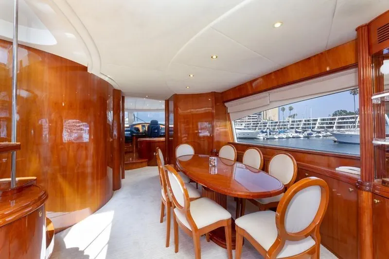 Slide: The Image of Luxurious interior of 2000 Azimut 85 Ultimate yacht with elegant dining area and marina view. - 55