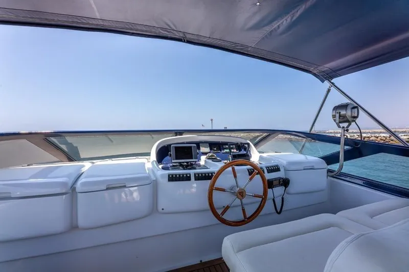 Slide: The Image of Cockpit of 2000 Azimut 85 Ultimate yacht with steering wheel and navigation equipment. - 19
