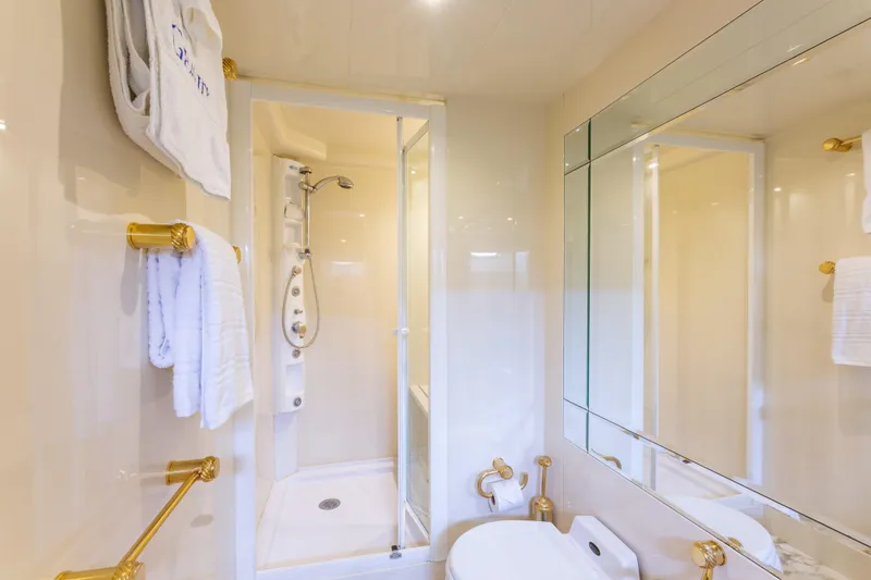 Slide: The Image of Luxurious bathroom on 2000 Azimut 85 Ultimate yacht with gold accents and modern shower. - 44