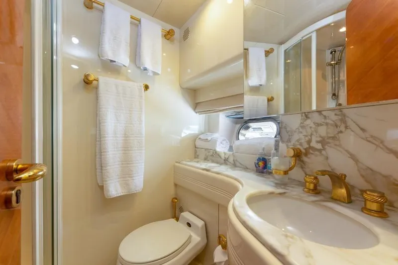 Slide: The Image of Luxurious bathroom on 2000 Azimut 85 Ultimate yacht with marble and gold accents. - 38