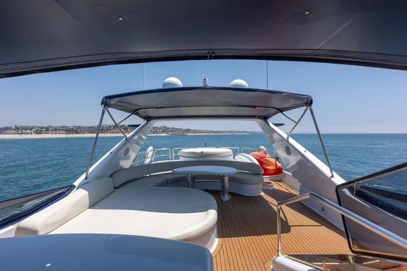 Slide: The Image of Luxurious 2000 Azimut 85 Ultimate yacht deck with ocean view and seating area. - 15