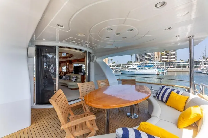 Slide: The Image of Luxurious 2000 Azimut 85 Ultimate yacht deck with elegant seating and marina view. - 11