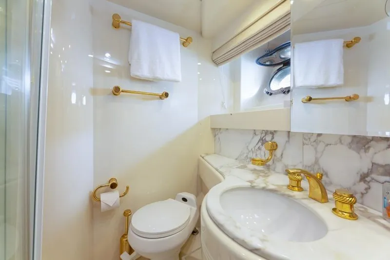 Slide: The Image of Luxurious yacht bathroom with marble accents and gold fixtures, Azimut 85 Ultimate, 2000 model. - 33