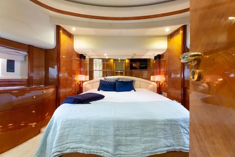 Slide: The Image of Luxurious bedroom interior of 2000 Azimut 85 Ultimate yacht with elegant wood finishes. - 41