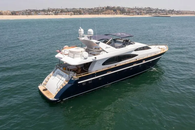Slide: The Image of Luxurious 2000 Azimut 85 Ultimate yacht cruising on open water near a scenic coastline. - 2