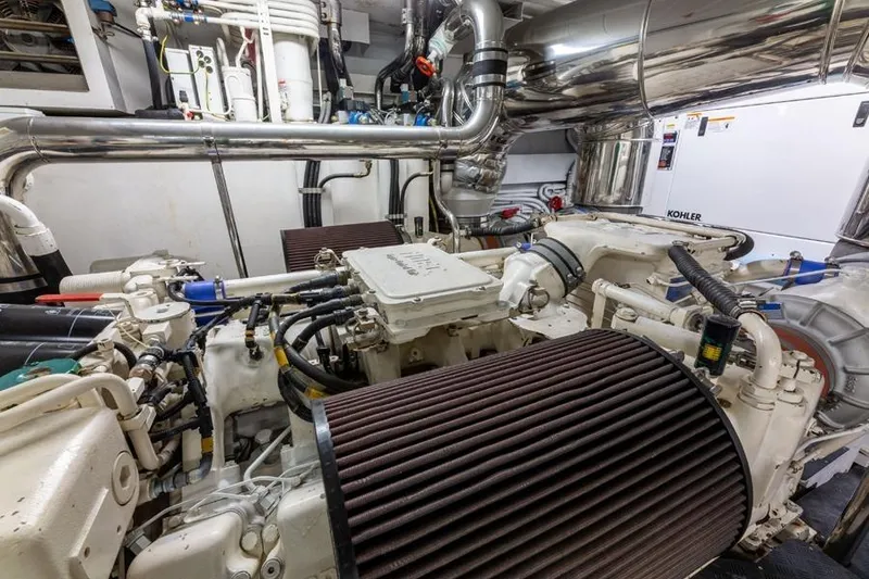 Slide: The Image of Engine room of a 2000 Azimut 85 Ultimate yacht, featuring complex machinery and piping. - 22