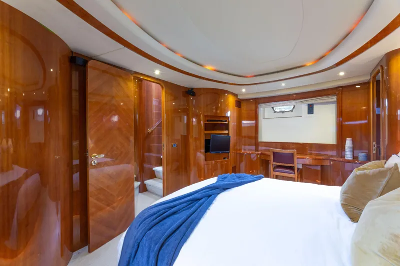 Slide: The Image of Luxurious cabin interior of 2000 Azimut 85 Ultimate yacht with elegant wood finish. - 49