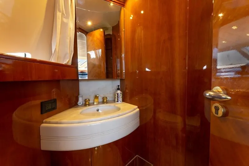 Slide: The Image of Luxurious bathroom interior on 2000 Azimut 85 Ultimate yacht with elegant wood finish. - 27