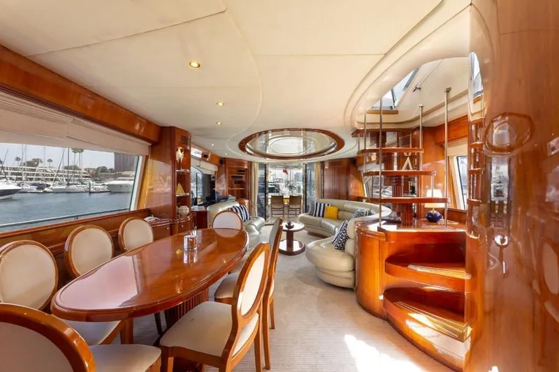 Slide: The Image of Luxurious interior of a 2000 Azimut 85 Ultimate yacht with elegant wood finishes and spacious seating. - 56