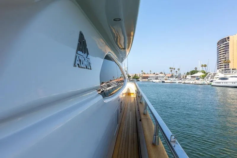 Slide: The Image of Side view of 2000 Azimut 85 Ultimate yacht docked in a marina. - 7
