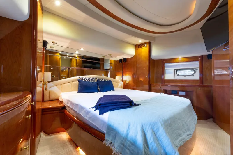 Slide: The Image of Luxurious bedroom interior of 2000 Azimut 85 Ultimate yacht with elegant wood finishes. - 40