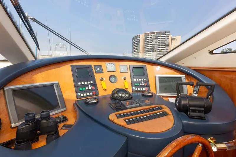 Slide: The Image of Cockpit of 2000 Azimut 85 Ultimate yacht with navigation instruments and controls. - 60