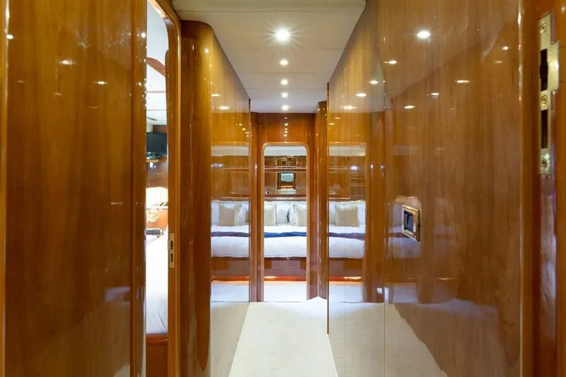 Slide: The Image of Luxurious interior hallway of a 2000 Azimut 85 Ultimate yacht with polished wood finish. - 28