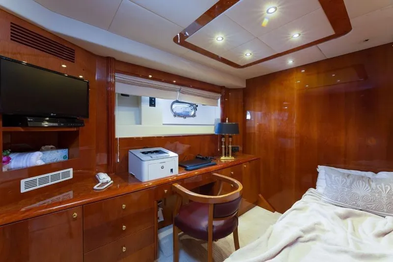 Slide: The Image of Luxurious cabin interior of 2000 Azimut 85 Ultimate yacht with wood finish and modern amenities. - 34