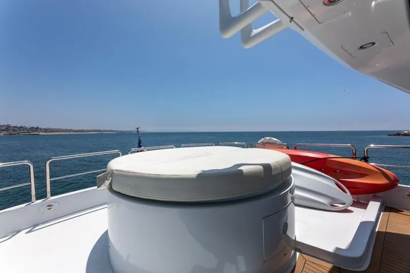 Slide: The Image of Azimut 85 Ultimate yacht deck with kayaks, ocean view, clear sky, 2000 model. - 13
