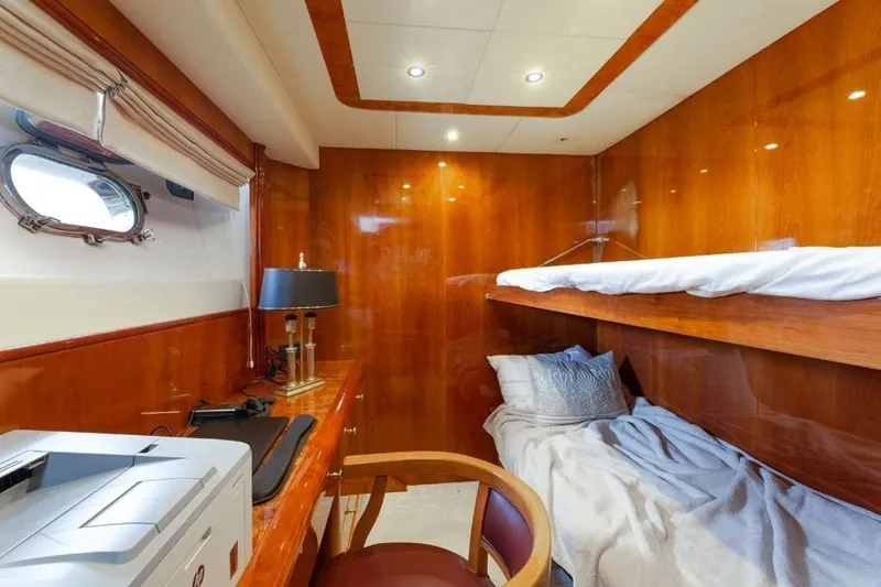Slide: The Image of Luxurious cabin interior of 2000 Azimut 85 Ultimate yacht with wooden finishes and bunk beds. - 35