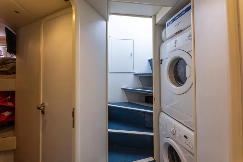 Slide: The Image of Laundry area with stacked washer and dryer on Azimut 85 Ultimate yacht, 2000 model. - 32