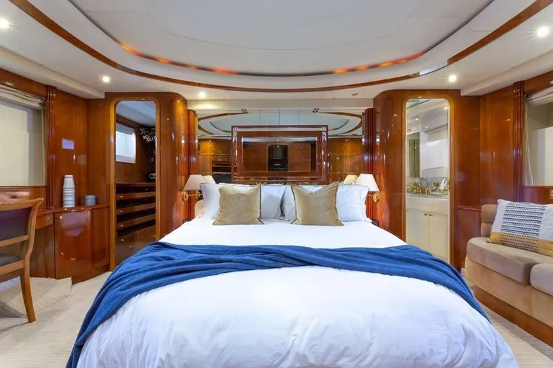 Slide: The Image of Luxurious bedroom interior of 2000 Azimut 85 Ultimate yacht with elegant wood finishes. - 51