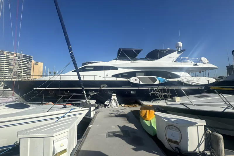 Slide: The Image of Luxury yacht Azimut 85 Ultimate 2000 docked at marina under clear blue sky. - 4