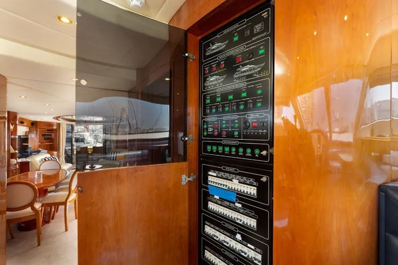 Slide: The Image of Interior of 2000 Azimut 85 Ultimate yacht showing control panel and luxurious seating area. - 26