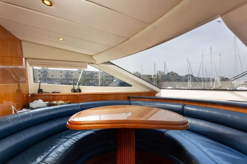 Slide: The Image of Luxurious interior of 2000 Azimut 85 Ultimate yacht with elegant seating and wooden table. - 59