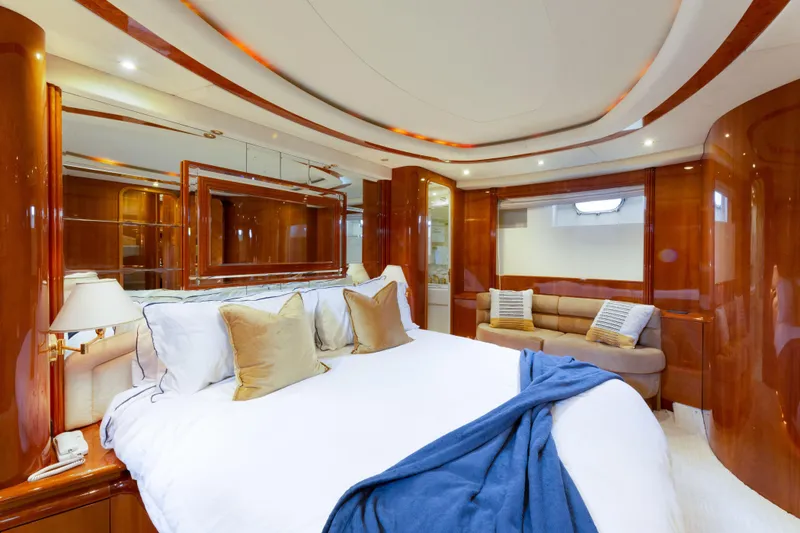 Slide: The Image of Luxurious bedroom interior of 2000 Azimut 85 Ultimate yacht with elegant wood finishes. - 50