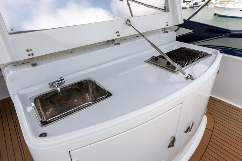 Slide: The Image of Outdoor kitchen on 2000 Azimut 85 Ultimate yacht with sink and grill. - 12