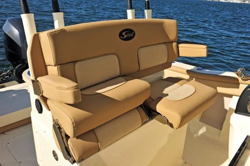 Slide: The Image of The 2020 Scout 277 LXF features luxurious beige upholstery with armrests on a boat. - 13