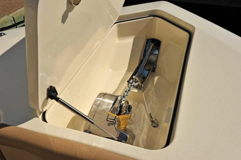 Slide: The Image of An open anchor compartment on a Scout 277 LXF boat, showing anchor and chain. - 10