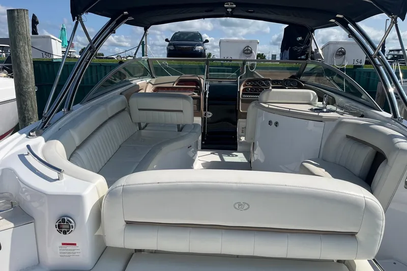 Slide: The Image of 2008 Cobalt 323 boat interior with white seating and sleek dashboard design. - 5