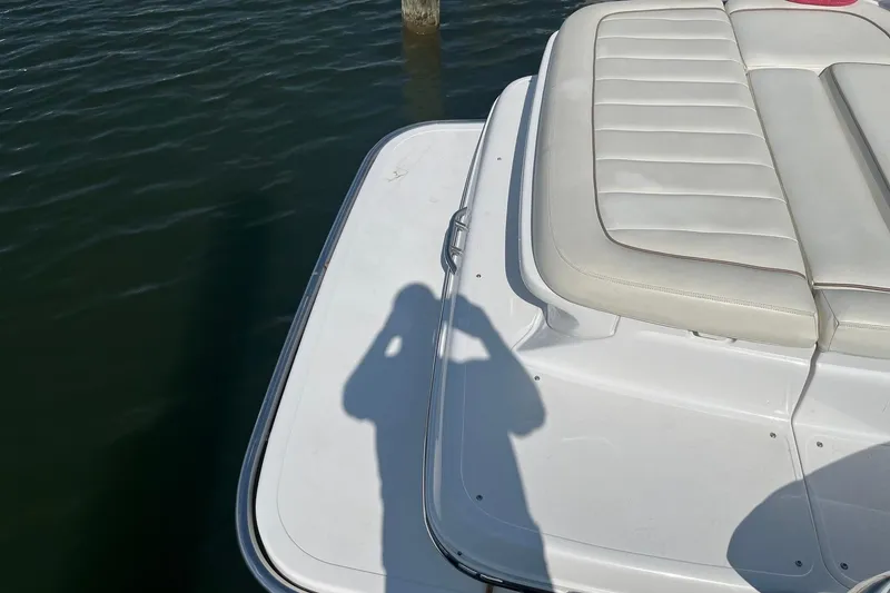 Slide: The Image of Rear view of a 2008 Cobalt 323 boat with white seating and water reflection. - 9