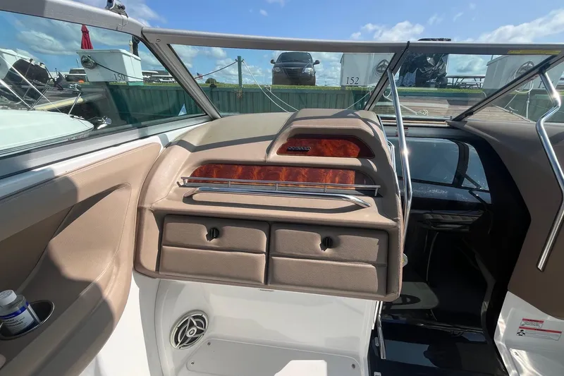Slide: The Image of Interior view of a 2008 Cobalt 323 boat, featuring dashboard and seating area. - 17