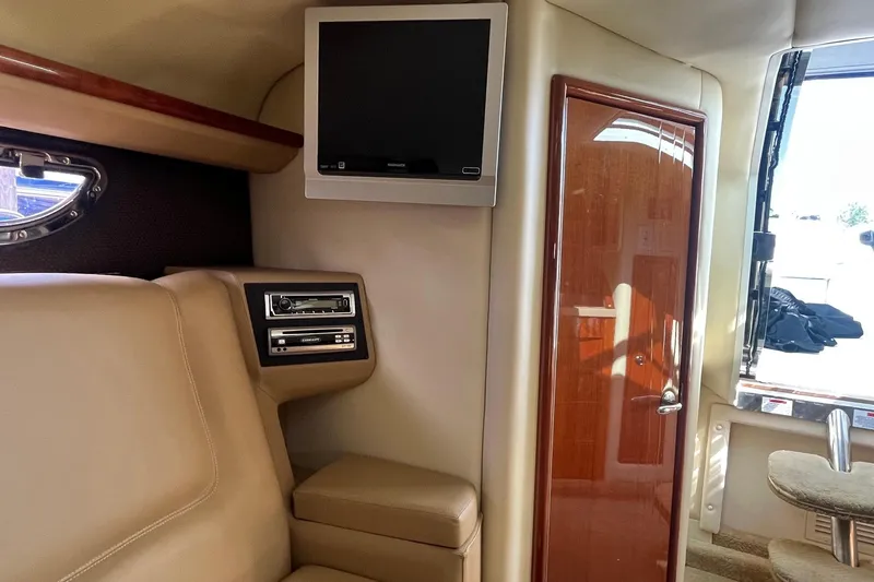 Slide: The Image of Interior of a 2008 Cobalt 323 boat with TV and audio system. - 33