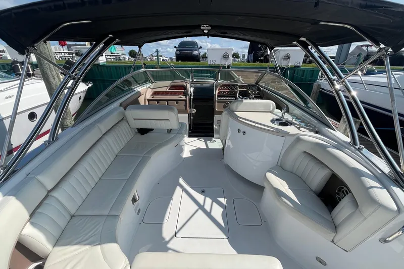Slide: The Image of Luxurious 2008 Cobalt 323 boat interior with white seating and sleek dashboard. - 4