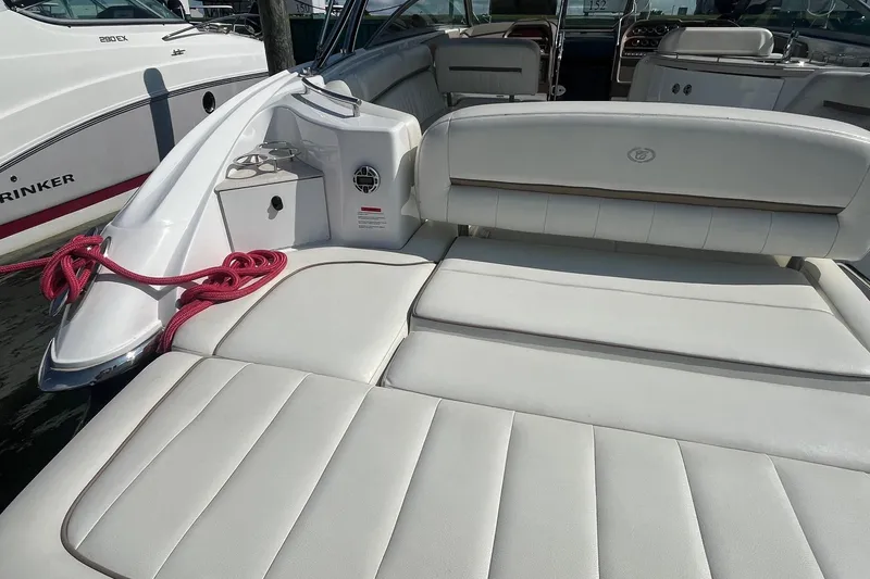 Slide: The Image of Luxury 2008 Cobalt 323 boat interior with white leather seating and red rope accents. - 10